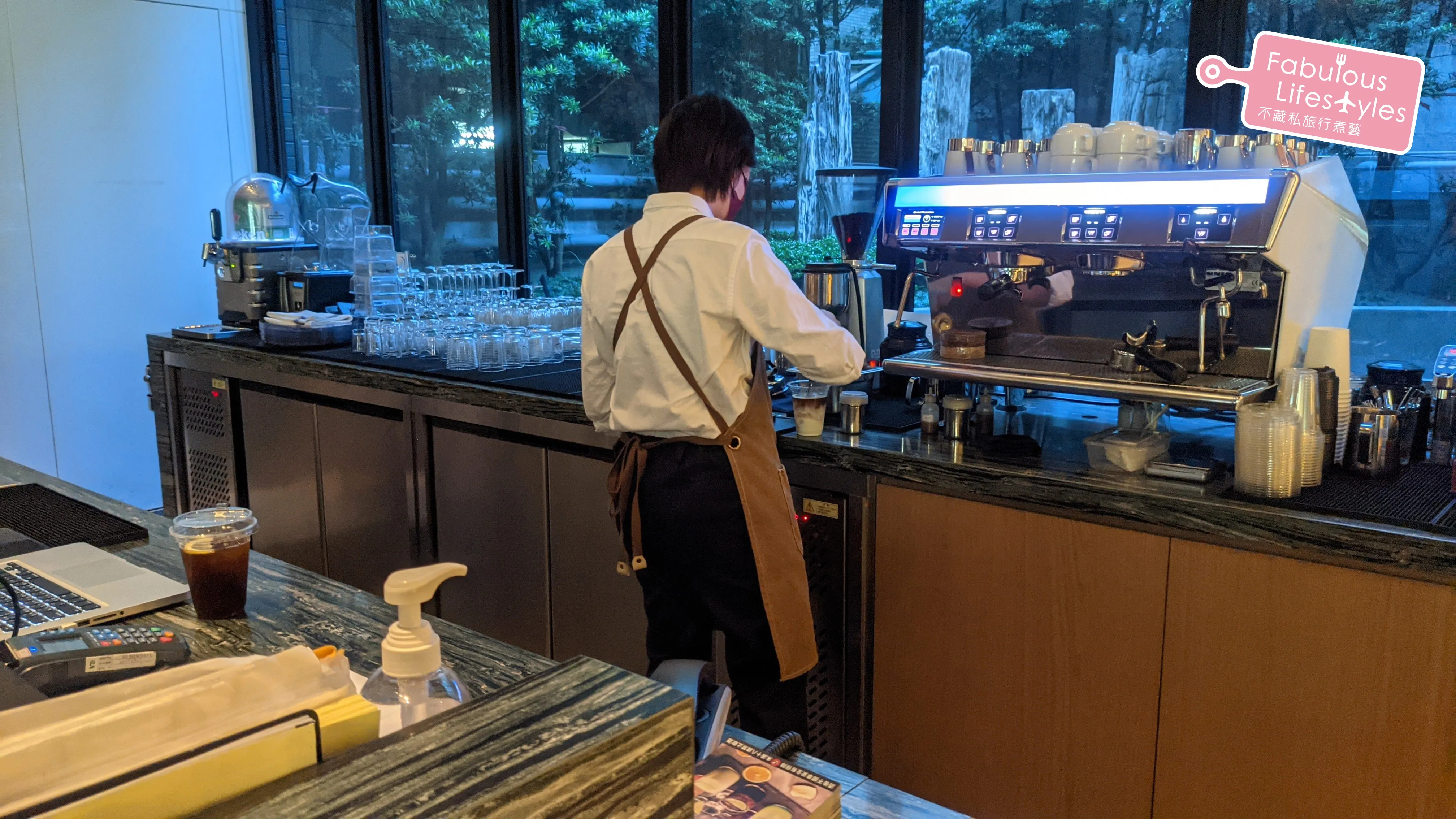The bartender at "La Salle" carefully making a latte