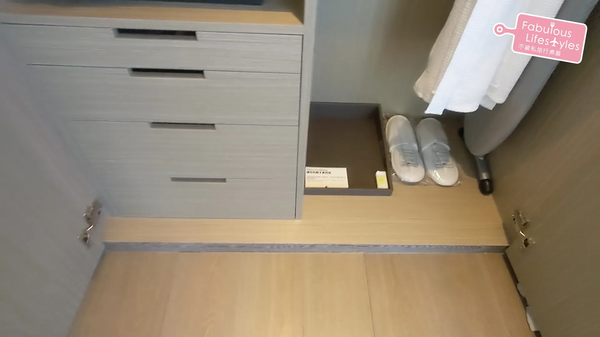 Small storage drawer below the wardrobe